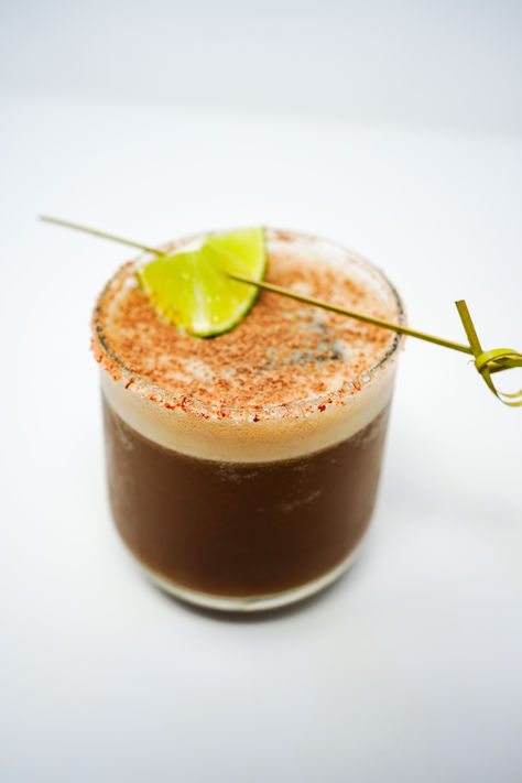 An Orange Mocha Mezcal Margarita is a captivating blend of smoky mezcal, rich coffee, velvety chocolate, and vibrant orange, creating a uniquely complex and indulgent drinking experience. Coffee Margarita, Fall Mezcal Cocktails, Mezcal Drinks, Cowboy Cocktails, Drink Garnish Ideas, Unique Margarita Recipes, Mezcal Tequila, Mezcal Margarita, Mezcal Cocktails