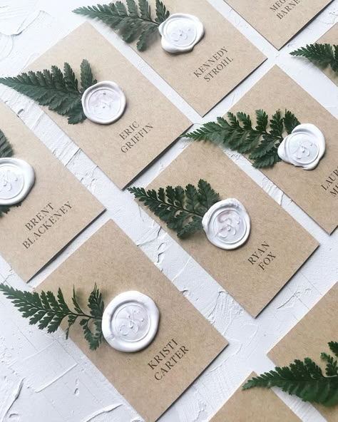 White details with greenery for elegant place settings Forest Wedding Reception, Wax Seal Wedding, Fern Wedding, Riverside Weddings, Wedding Reception Planning, Place Cards Wedding, Forest Theme Wedding, Wedding Greenery, Cheap Wedding Venues