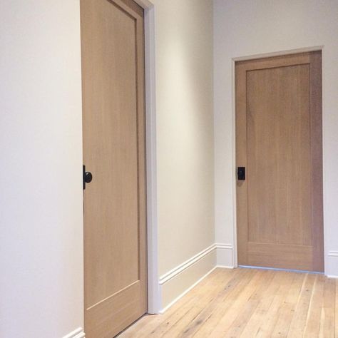 Blonde floors, white oak doors, black hardware Interior Door Black Hardware, Interior Door Styles Modern Wood, Wood Arch Door, Kaemingk Design, Interior Door Black, Fir Doors, Blonde Flooring, Interior Doors White, Interior Doors Modern