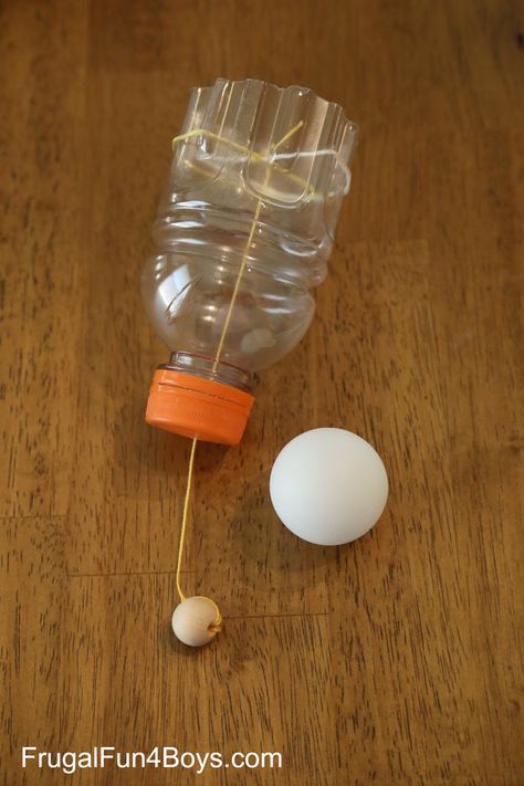 MAKE A PING PONG BALL LAUNCHER! July 6, 2016 by Sarah 2 Comments  3K+ Shoot ping pong balls through the air with this fun (and simple!) homemade toy.  You probably have everything on hand to make one, and it’s a great opportunity to learn about the transfer of energy also.  Yay for STEM learning!    We found this idea on arvindguptatoys.com, and it’s a brilliant idea!  Pull the string back and let go, and the ball goes flying!  To make one you’ll need:  An empty plastic bottle.  We used the ... Transfer Of Energy, Toys From Trash, Babysitting Activities, Ball Launcher, Carnival Themed Party, Ping Pong Balls, Stem For Kids, Homemade Toys, Diy Projects For Kids