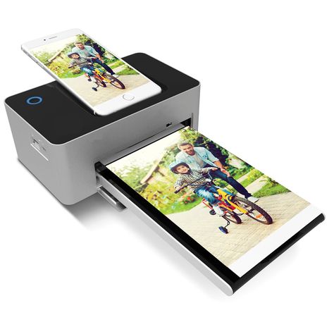 The iPhone Charging Photo Printer Iphone Printer, Portable Photo Printer, Iphone Dock, Iphone Charging, Hammacher Schlemmer, Portable Printer, Phone Gadgets, Gadgets To Buy, Photo Printer