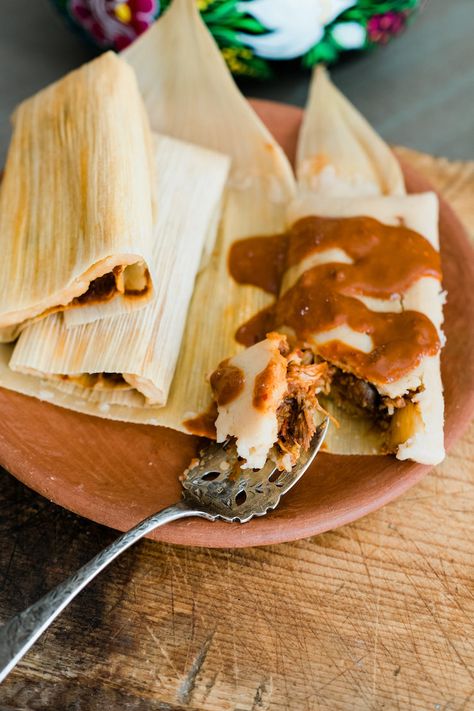 Ever since my trip to Oaxaca, we learned how to make tamales filled with chicken mole wrapped in banana leaves. They were absolutely delicious and beautiful tamales. I prefer mole that is spicy rather than sweet and this mole rojo is thick, rich, chocolate-tinged, and spicy. This mole is manageable to make because it only … Mole Burrito, Mole Tamales, Mole Recipes, Latin Meals, Authentic Tamales, Tamale Filling, Making Tamales, Bueno Recipes, Chicken Tortillas