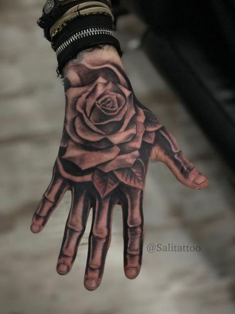 Rose hand tattoo with skeleton fingers Rosen Tattoo Mann, Mens Face Tattoos, Tattoo Main, Rosen Tattoo Frau, Herren Hand Tattoos, Full Hand Tattoo, Hand Tattoo Designs, Skull Hand Tattoo, Tato Jari