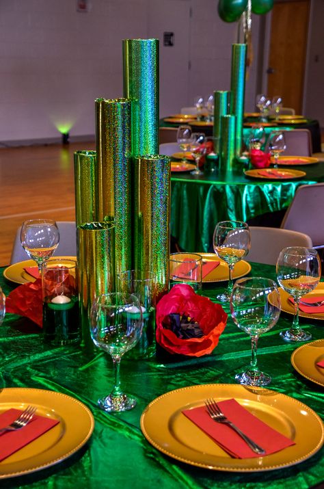 "Emerald City" themed Table Decor. The Wiz Party Ideas Emerald City, Emerald City Prom Theme, Diy Emerald City, Wizard Of Oz Decorations Emerald City, Emerald City Party Decorations, Emerald City Theme Party, Emerald Theme Party, Wizard Of Oz Prom Theme, Emerald City Decorations