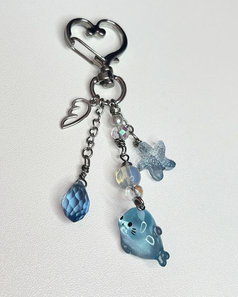 NEW Seal Key Chain! ($12.99) Got more seals in stock! Will be releasing more keychains and phone charms soon! I’m in love with this keychain, wish I could keep it for myself, the colors are just too cute and the seal 🩵 Available now! Link in bio! - - - #seals #charms #smallbusiness #owner #jewelry #beaded #beads #keychain #beach # ocean #sea #homemade #blue #cute #charm #y2k Sea Seal, Freebie Stickers, Beach Keychain, Blue Starfish, Blue Charm, Chain Accessories, A Wing, Phone Charms, Sea Ocean