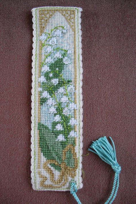 Lily of the Valley bookmark. My second cross-stitch project from Textile Heritage. Flower Cross Stitch Bookmark, Cross Stitch Bookmark Ideas, Lily Of The Valley Cross Stitch, Crosstitch Bookmark, Cross Stitch Lily, Cross Stitch Bookmark Patterns Free, Cross Stitch Bookmark Patterns, Cross Stitch Pattern Free, Bookmark Cross Stitch Pattern