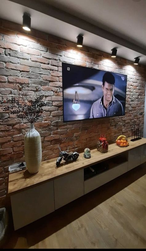 Cement Walls Living Room, Brick Wall Tv Room Decor, Brick Wall With Tv, Brick Wall Tv Unit Design, Brick Wall Interior Living Room Modern, Brick Tv Wall Ideas, Brick Tv Wall, Brick Wall Tv, Warm Industrial Living Room