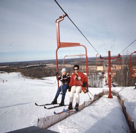 Slightly elevated view of two young people riding the chair lift at a ski hill. Image ID: 130331 Ski Chair Lift Bench, Ski Lift Aesthetic, Old Ski Lift Chair, People Skiing, Ski Lift Photography, Ski Lift Chair, Masters Chair, Ski Chair, Pine Chairs