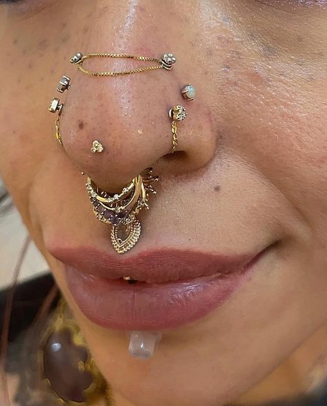 Rinku on Instagram: “"From basic to bold, this nostril piercing has come a long way! Swipe Left -to see the journey from a double high nostril to a stunning…” Nose Piercing Curation, Septril Piercing Nose, Madussa Piercing, Gold Facial Piercings, Double Septum Piercing, Unique Piercings Face, Facial Piercings Aesthetic, Vertical Philtrum, Chic Tattoo Ideas