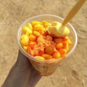 Boiled sweet corn is seasoned with salt, margarine or butter. Some serve it on cob; others serve it in cups filled with corn kernels mixed with cheese powder and butter. Corn With Cheese, Boiled Sweet Corn, Boil Sweet Corn, Corn In A Cup, Corn Cheese, Buttered Corn, Cheese Powder, Fan Drawing, Creamy Corn