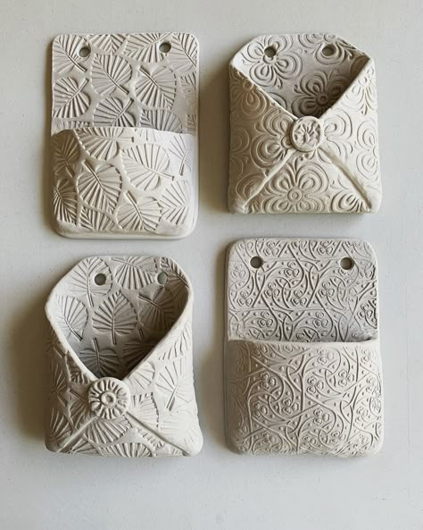 Dorothy Domingo on Instagram: “I made some new wall pockets in white clay. Impatiently waiting for them to dry out so I can get the bisque load firing, but the clay is…” Slab Ceramics, Pottery Lessons, Beginner Pottery, Pottery Handbuilding, Clay Crafts Air Dry, Keramik Design, Slab Pottery, Hand Building, Hand Built Pottery