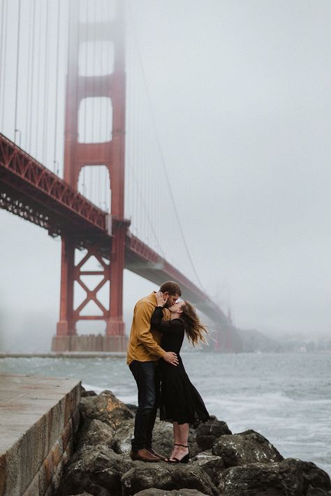 San Francisco was having a bit of a cold front in the middle of summer. We had planned another spot to get views of the Golden Gate Bridge, but when we saw that the fog had rolled in and covered up the top of the bridge, we quickly pivoted and rearranged some of our plans for the day. We went to the closest viewpoint of the bridge on the SF side to get a few shots with the lower structure of the bridge that was visible underneath the fog. Bridge Engagement Photos, San Francisco Pictures, San Francisco Elopement, San Francisco Bridge, Architecture City, Bridge Pose, The Golden Gate Bridge, Golden Gate Park, San Francisco City