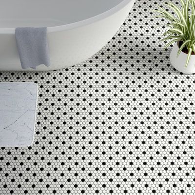 Transform your space into a tribute to retro design with our Metro Hex Matte White with Black Dot 10-1/4 in. x 11-7/8 in. Porcelain Mosaic Floor and Wall Tile. As a modern deviation from the classic hexagon mosaic, this tile option is a throwback to traditional retro design with a contemporary feel. Matte white hexagons are accented by contrasting black chips and precisely arranged on an interlocking mesh to create a seamless installation. This minimalistic geometric porcelain mosaic is unique y Penny Tiles Bathroom, Hex Tile, Penny Tile, Merola Tile, Black And White Tiles, Porcelain Mosaic Tile, Hexagonal Mosaic, Hexagon Tiles, Mosaic Flooring