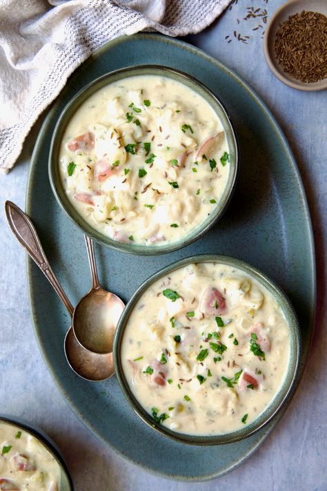 This Creamy Potato Soup recipe is perfect whenever you need a warm and nourishing meal! Subtly sweet green cabbage and red potatoes simmer in a rich broth, then topped off with light cream and some savory ingredients for a rich, comforting and budget-friendly soup. Cream Cabbage Soup, Potato Cabbage Soup, Cabbage And Potato Soup, Chilled Soup Recipes, Cabbage Potato Soup, Creamy Cabbage, Soup And Stew Recipes, Creamy Potato Soup Recipe, Creamed Cabbage