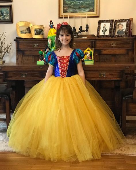 Here is our Snow White dress, inspired by Disney, just gorgeous and sweet as your little princesses :) It is our own design and make, handmade with love using highest quality sequin fabric, satin, crystal tulle, greek tulle with a petticoat attached to the body. It has satin lining all over the bodice and sleeves to prevent irritation to the sensitive skins and has a zipper White Birthday Dress, Gown Yellow, Snow White Dress, Snow White Dresses, Snow White Costume, Snow White Birthday, White Costume, White Costumes, White Birthday