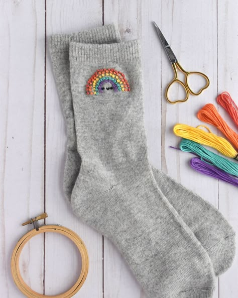 Do you know what you should do this weekend? Embroider rainbows on your socks! 🌈🧦 You can find my pattern and instructions for these in the latest issue of @simplysewingmag (issue 118). Let me tell you…they absolutely make me smile! As an added bonus, you can use your favorite rainbow of embroidery floss to truly make them your own! #embroidery #embroideredclothing #handstitched #instastitch #modernembroidery #kawaiicute #simplysewingmag #stitchupcycle Embrodery Socks, Embroider Socks Diy, Embroidery On Socks, Sock Embroidery, Socks Embroidery, Sock Ideas, Embroidery Socks, Embroidered Sweaters, Wild Olive