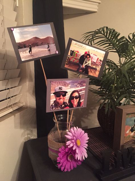 Made these for table centerpieces at my "By the beach wedding!" Double sided pictures, used hot glue gun and card stock paper! I printed 12 photos at Walmart for under $4 and used $1 store materials to decorate the vase! Total project for two approx $12 with extra materials left over. Vase With Pictures Centerpieces, Centerpieces With Photos In Them, Photo Centre Piece Ideas, Picture Cube Centerpiece, Centerpieces Using Photos, Bridal Shower Photo Centerpieces, Photo Vase Centerpiece, Photo Frame Centerpiece Ideas, Table Top Photo Display