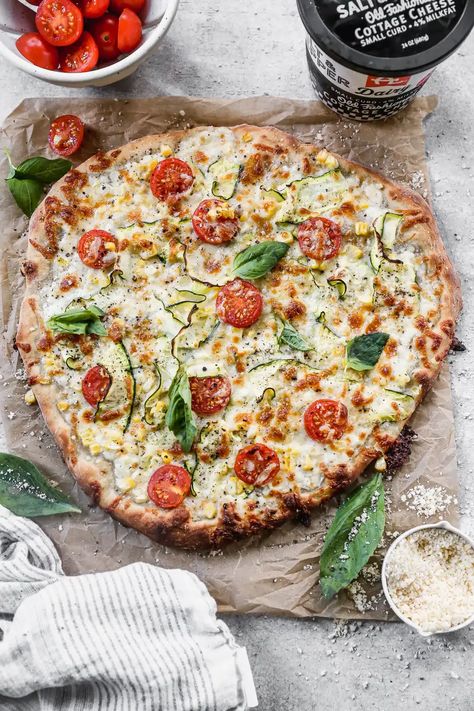 Cottage Cheese Pizza is the summer pie you never knew you needed. With a creamy, tangy cottage cheese and sharp provolone base and a delicate shaved zucchini, sweet corn and cherry tomato topping, this veggie forward pizza is truly a winner. Cottage Cheese Pizza, Tomato Topping, Cheese Crust Pizza, Pizza Cooking, Pizza Topping, Summer Pie, Favorite Recipes Dinner, Pizza Recipes Homemade, Savory Appetizer