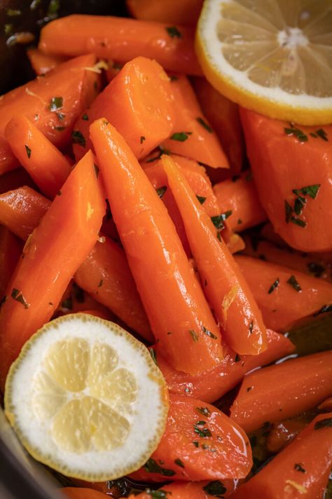 Honey Lemon Glazed Carrots from The Food Charlatan. This EASY recipe for honey lemon glazed carrots is made in the slow cooker for a no-fuss vegetable side dish for the holidays! Or for any weeknight really, because this stuff tastes like candy and who doesn't want to eat honey carrots that are this sweet and delicious? The lemon gives them the perfect tang. #crockpot #easy #recipe #slowcooker #carrots #lemon #sidedish #vegetable #glazed #Thanksgiving #Christmas #holidays #best #sweet #honey Slow Cooker Carrots, Lemon Carrots, Carrots Glazed, Green Bean Casserole Crock Pot, Honey Carrots, Glazed Carrots Recipe, Maple Glazed Carrots, Honey Glazed Carrots, The Food Charlatan