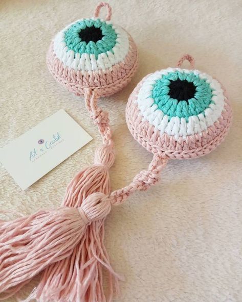 Crochet evil eye hanging charm Color combination : mint-powder pink Diameter : 12 centimetres It is hand crocheted in Greece using eco friendly 100% cotton yarn.If you want another color or size dont hesitate to send me a message with your preference.Custom orders are welcomed. * You can wash it Crochet Evil Eye, Evil Eye Hanging, Crochet Eyes, Car Charms Mirror, Crochet Wall Hangings, Iron Beads, Crochet For Home, Baby Wrap Carrier, Handmade Cushions