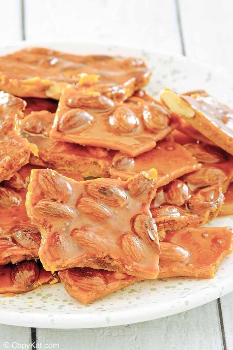 Almond brittle is delicious and crispy candy enjoyed for generations. Get the easy recipe and learn how to make the best brittle with almonds. Find out a simple ingredient swap to make almond brittle with no corn syrup. A great candy to make for the holidays and homemade gifts. #almondbrittle #easycandyrecipe #christmascandy Holiday Entertaining Food, Almond Brittle, Easy Candy Recipes, Brittle Recipes, Candied Almonds, Candy Truffles, Copykat Recipes, Beef Casserole Recipes, Peanut Brittle