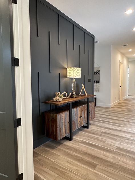 Entryway With Black Wall, Black Farmhouse Accent Wall, Entry Wall Accent Wall, Accent Wall Small Office, Entry Hallway Accent Wall, Accent Wall Foyer Entryway, Boys Accent Wall Ideas, Black Trim White Walls, Black Wall With Wood Accents