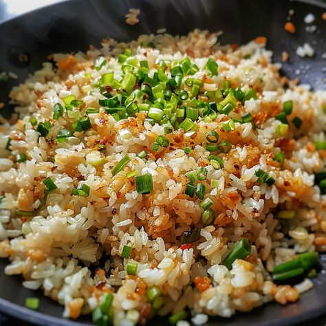 🍚 Enjoy the aromatic and flavorful Sinangag! �🧄✨ #GarlicFriedRice #FilipinoComfort Sinangag (Filipino Garlic Fried Rice) Ingredients: Cooked rice (4 cups) Garlic, minced (6 cloves) Oil (2 tbsp) Salt to taste Green onions, chopped (for garnish) Instructions: Heat oil in a pan over medium heat. Add minced garlic and sauté until golden brown. Add cooked rice and stir-fry until heated through. Season with salt to taste. Garnish with chopped green onions before serving. 🌟 Simple yet flavorful, ... Fried Rice Filipino, Filipino Garlic Fried Rice, Fried Rice Ingredients, Garlic Fried Rice, Instagram Recipes, Cooked Rice, Rice Ingredients, Trending Recipes, Green Onions