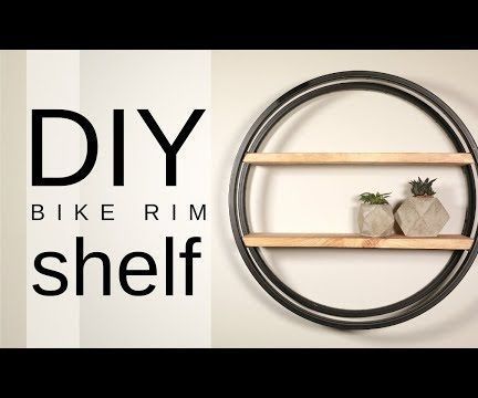 DIY Industrial Bike Rim Shelf Bicycle Rim Projects, Tire Shelf, Repurposed Tire, Diy Bicycle, Recycled Bike Parts, Modern Shelving Units, Tire Craft, Style Shelf, Bicycle Rims