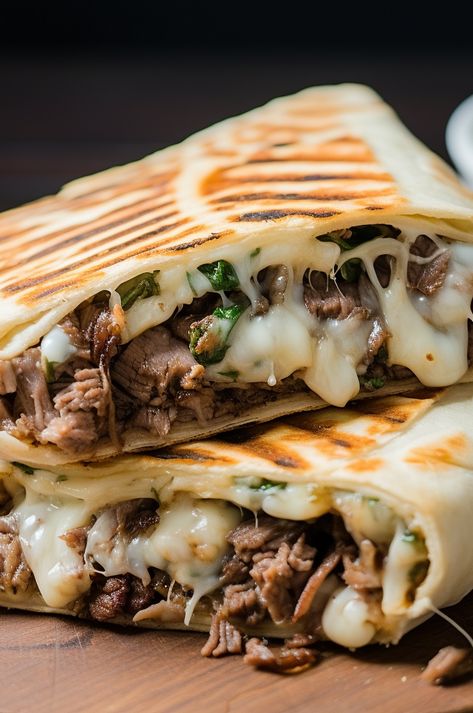 A delicious and easy-to-make grilled wrap filled with all the flavors of a Philly Cheesesteak sandwich. Philly Steak Wraps Recipes, Grilled Tortilla Sandwiches, Philly Cheesesteak Burrito, Keto Philly Cheesesteak Wraps, Cheesesteak Wrap Philly, Philly Cheese Wraps, Cheesesteak Dinner Ideas, Camping Philly Cheese Steak, Philly Cheese Crunchers