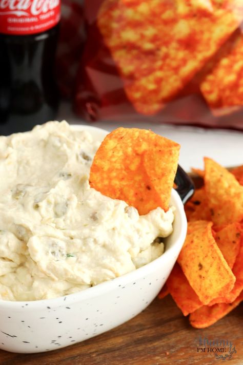 When it comes to easy recipes for a party, it doesn't get much better than this Doritos dip! It's made with cream cheese and green chilies, making it a creamy cheese dip perfect for Nacho flavored tortilla chips! Make it in the slow cooker or eat it cold. Dip For Doritos, Doritos Dip, Creamy Cheese Dip, Dorito Dip, Slow Cooker Dips, Best Dip Recipes, Gluten Free Pretzels, Nacho Chips, Green Chiles