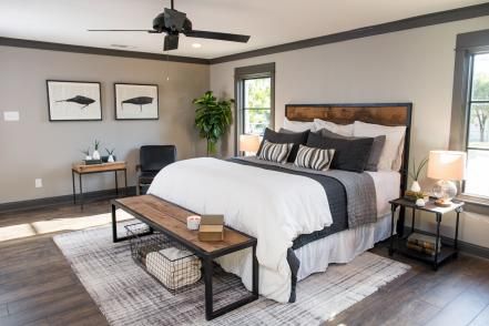 Yet another wall was removed in order to merge two bedrooms and create an enlarged master suite. Joanna maintained the earthy and masculine aesthetic with dark wood floors, contrasting tones, gray walls, plenty of wood and a pair of framed prints based on vintage fishing-lure designs. Joanna Gaines Bedroom, Farmhouse Decor Joanna Gaines, Farmhouse Bedroom Decor Ideas, Masculine Bedroom, Modern Farmhouse Bedroom, Small Bedrooms, Industrial Bedroom, Decor Ikea, Farmhouse Bedroom Decor