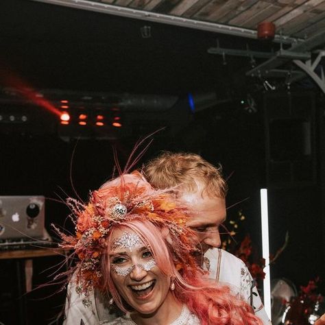 Petalhead Dried Flower Design- Alex on Instagram: "May @allthevibrantandvintage brighten up your wet wintry Monday. You are welcome. I met Finn at the @rocknrollbride show earlier this year, and she commissioned me to make a ‘piece of art for my head’ that included disco balls and would work with her pink hairdo for the evening wedding party at @ramsgatemusichall. I was excited to oblige, creating a voluminous flower crown out of dried pink and orange flowers and grassses, disco balls and hot pink preserved roses. She even got her man-of-honour to wear a matching garland! I am blown away by the photos that @nickisheaphotography took, and basically think that all brides should have this much fun! (There was crowd-surfing involved as well, hence the ‘need’ for a divine @nadinemerabi catsuit Crowd Surfing, Pink And Orange Flowers, Man Of Honour, Preserved Roses, Disco Balls, Evening Wedding, Orange Flowers, Dried Flower, Catsuit