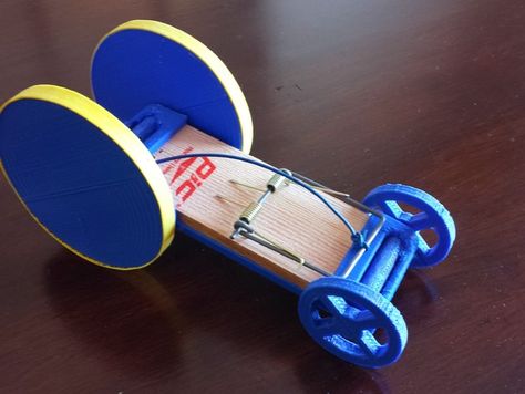 This is a 3D printed mouse trap racer, which demonstrates the physics principle of the conversion of potential energy to kinetic energy by using the spring of a mouse trap to spin the axle of the wheels.   EDIT: By popular request I recorded a quick video of the racer in action. http://www.youtube.com/watch?v=dZ3QAxe7-LE Mouse Trap Stem Project, Mousetrap Car, Kinetic Toys, Mouse Trap, Potential Energy, Mouse Traps, Car Racer, Kinetic Energy, Stem Projects