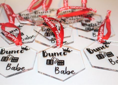 #homeliving #homedecor #ornamentsaccents #christmas #ornament #family #gift #exchange #bunco #game #night #girls #ladies #favor #babes #queen Bunco Ornaments, Christmas Gift Exchanges, Bunco Christmas, Bunco Prizes, Bunco Gifts, Present Toppers, Bunco Game, Christmas Gift Exchange, Clear Ornaments