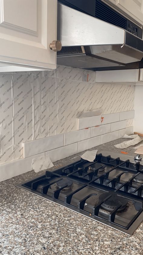 Woman installing backsplash tile with Musselbound tile adhesive. GIF of easy DIY tile installation of white subway tile in kitchen. Adhesive Tile Backsplash, White Subway Tiles Kitchen Backsplash, Easy Kitchen Backsplash, Backsplash Installation, White Subway Tile Kitchen, Install Backsplash, Self Adhesive Backsplash, Easy Backsplash, Kitchen Backsplash Tile Designs