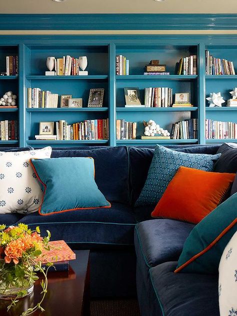 Living room features a blue velvet sectional accented with orange and blue pillows and turquiose blue built in shelves. Blue Family Rooms, Blue Couch, Family Room Sofa, San Francisco Houses, Interior Design Process, Transitional Living, Beautiful Sofas, Transitional Living Rooms, House Beautiful