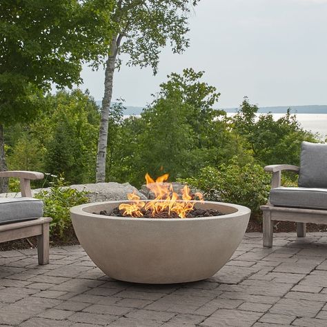 The Alta Natural Gas Fire Bowl has a natural finish and a timeless style that blends easily into existing backyard or patio settings. Our reliable brass burner system produces a full, bright flame. Handcrafted in the USA by our skilled team of artisans. Made of ultra-durable glass fiber reinforced concrete (GFRC). Heat, weather, and rust resistant. Offering our tallest, brightest, and fullest flame. Includes fire table, black lava rock, polyester protective cover and valve key. 5 year limited wa Round Propane Fire Pit, Propane Fire Bowl, Propane Tank Cover, Natural Gas Fire Pit, Types Of Fire, Propane Fire Pit Table, Round Fire Pit, Fire Pit Bowl, Concrete Fire Pits