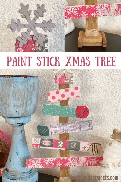 Tis’ the Season to get crafty with this gorgeous Paint Stick Christmas Tree! Grab some coordinating vintage Holiday patterned scrapbook paper, some 1 gallon paint sticks from your local Home Depot, and your trusty glue gun, and make this easy and adorable piece of DIY Christmas decor! #christmasdecor #christmascrafts #diychristmas Paint Sticks Projects, Stick Christmas Tree, Paint Sticks, Diy Christmas Decor, Wooden Snowman, Craft Planner, Christmas Tree Painting, Craft Stash, Pine Cone Crafts