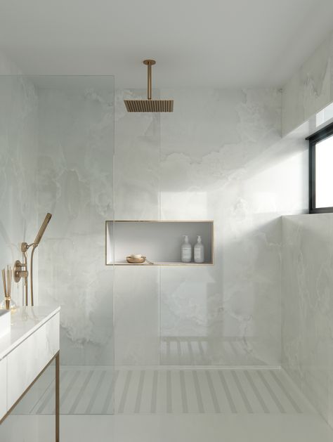 Dekton - Stonika Xgloss Collection Helena Format: 320 x 144 cm Thicknesses: 0.4cm 0.8cm 1.2cm 2cm Available with mesh Latest Modern Bathroom Designs, Modern Bathroom Trends, Gold Faucet, Bad Inspiration, Bathroom Top, Bathroom Trends, White Bathroom, Modern Bathroom Design, Shower Room