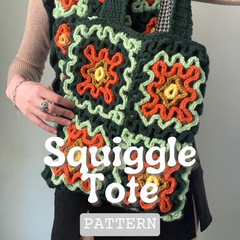 The Squiggle Tote is just the unique pattern you've been looking for! Ditch the typical granny square and go for this squiggle stitch project instead. The squiggle technique, which has been traditionally used for pillows, potholders, and blankets, is now adapted for this groovy wearable! This pattern is written in english and uses U.S. crochet terms. This is an intermediate level pattern and utilizes many different stitches in its construction. You will need to weave in many ends during the cons Quickest Crochet Projects, Granny Square Puff Stitch, Fiber Art Crochet, Crochet Essentials For Beginners, Things To Do With Crochet, Crochet Patterns Granny Square Easy, Crochet Patterns Pillows, Multicolor Yarn Crochet Projects, Scrappy Crochet Projects