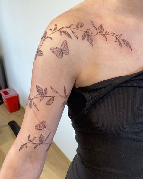 leafy vibe wrap with some dainty butterflies & her daughter’s birthday 🌿🦋 appointment type: half day session • • • #utahtattooartist… | Instagram Flower Butterfly Wrap Around Tattoo, Dainty Floral Arm Wrap Tattoo, Upper Arm Floral Wrap Tattoo, Shoulder Arm Wrap Tattoo, Leaves Wrapped Around Shoulder Tattoo, Leaf Vine Sleeve Tattoo, Butterflies Wrapped Around Arm Tattoo, Leaf And Butterfly Tattoo, Matching Vine Tattoos