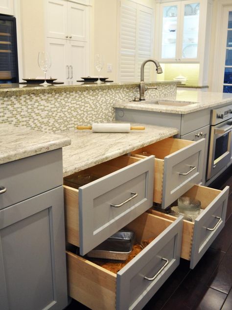 A marble-topped island baking station with its own oven makes preparing sweet treats easy in this traditional kitchen with white Shaker-style cabinets. Designer Nar Bustamante created custom storage to utilize every nook and cranny throughout the neutral space, eliminating clutter and increasing functionality. Kitchen Baking Station, Baking Center, Black Kitchen Table, Baking Station, Kitchen Island With Sink, Craftsman Kitchen, Kitchen Island Table, White Kitchen Island, Kitchen Corner