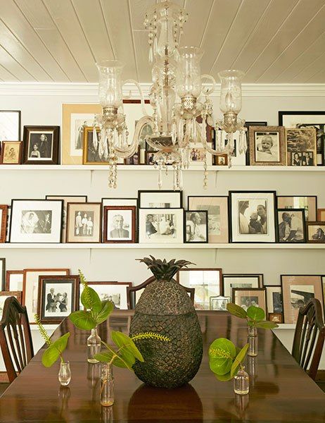 An amazing gallery wall with layered photographs. India Hicks Island Style, India Hicks Style, Florida Houses, Picture Placement, British Colonial Decor, India Hicks, British Colonial Style, Colonial Decor, English Design