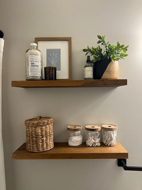 Bathroom Shelves Over Toilet Styling, Apartment Bathroom Shelves, Basket On Top Of Toilet, Toilet Shelf Styling, Above Toilet Decor Minimalist, Neutral Restroom Decor, Neutral Bathroom Decor Ideas Earth Tones, Guest Bathroom Themes, Shelf In Bathroom Above Toilet