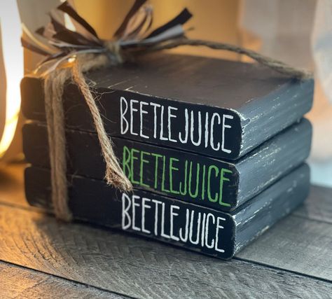 Cricut Book Stack, Beetle Juice Craft Ideas, Fall Craft Sale Ideas, Beetlejuice Decorations Diy Crafts, Halloween Stacked Books, Beetlejuice Beetlejuice Beetlejuice, Beetlejuice Crafts Diy, Halloween Book Stacks, Beetlejuice Crafts