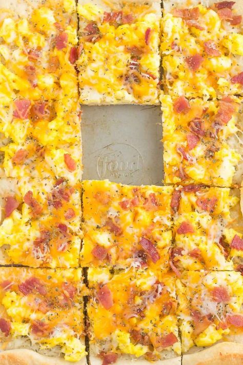 If you're looking for a new way to eat eggs and bacon, then this is it! This Bacon and Egg Breakfast pizza is filled with scrambled eggs, two kinds of cheese, and bacon, all sprinkled on top of a crisp crust. With just a few ingredients and minimal prep time, this breakfast pizza will be a meal time winner for breakfast, lunch, or even dinner! Egg Pizza Breakfast, Bacon And Egg Breakfast, Veal Meatballs, Breakfast Potluck, Work Potluck, Breakfast Pizza Recipe, Bacon Eggs Breakfast, Eggs And Bacon, Mexican Breakfast Recipes