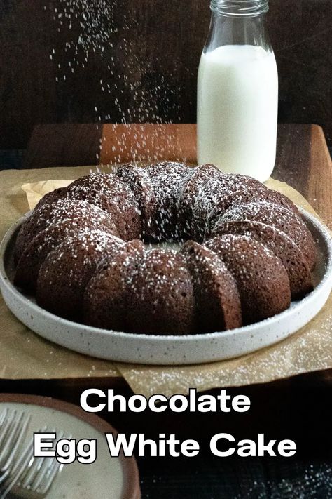 Chocolate egg white cake on plate with confectioner's sugar being sprinkled on it. Egg White Recipes Dessert, Egg White Cake, White Chocolate Mousse Cake, White Recipes, Easy Cake Recipe, Chocolat Cake, Egg White Recipes, Cocoa Cake, White Chocolate Cake