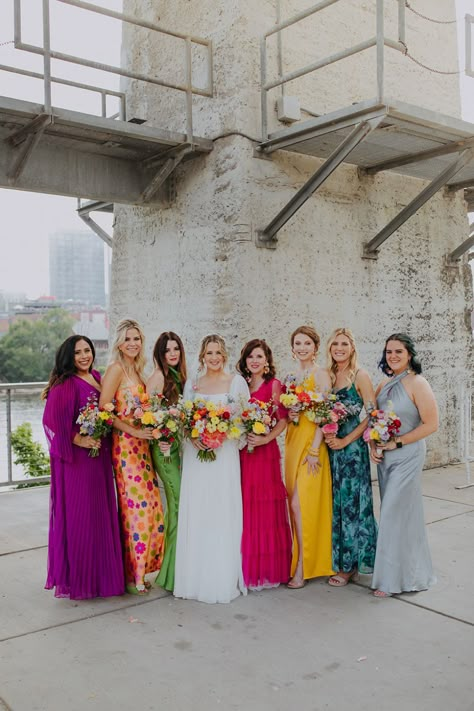 Unique Colorful Mismatched Bridesmaid Dresses for Spring Wedding with Vibrant Floral Bouquets Colourful Bridesmaid Dresses Different, Summer Boho Bridesmaid Dresses, Colourful Mismatched Bridesmaids, Bridesmaid Dresses Mismatched Bright Colors, Bright Jewel Tone Bridesmaid Dresses, Bright Summer Bridesmaid Dresses, Different Colour Bridesmaids, Bridesmaids With Different Color Dresses, Bold Colorful Wedding