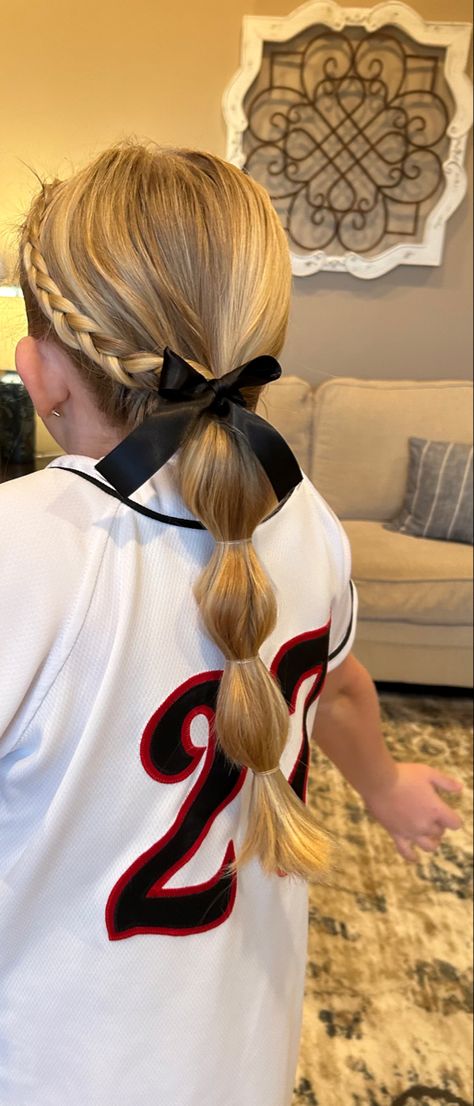 Softball Ribbon Hairstyles, Cheerleading Updos Cheer Hair, Hair For Tball Pictures, Toddler Girl Tball Hair, Softball Easy Hairstyles, Girls Baseball Hairstyles, Softball Hair With Ribbon, Quick And Easy Softball Hairstyles, T Ball Hairstyles Kids