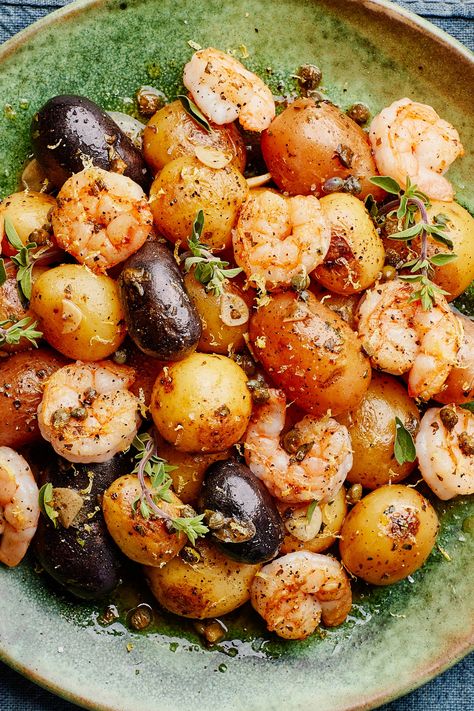 This short ingredient list features a handful of flavor powerhouses—namely garlic, oregano, capers, and lemon, which as a team can transform even the blandest proteins into a delightful meal. Here they dress quickly seared shrimp and boiled tiny potatoes to form an incredibly quick, weeknight-friendly meal. Look for peewee potatoes, which are 1½" in diameter or less and usually sold by the pound in a netted bag in the produce section. Tiny Potatoes, Seared Shrimp, Shrimp Zucchini, Tiny Potato, Greek Potatoes, Mini Potatoes, Lemon Garlic Shrimp, Potato Recipe, Fresh Oregano